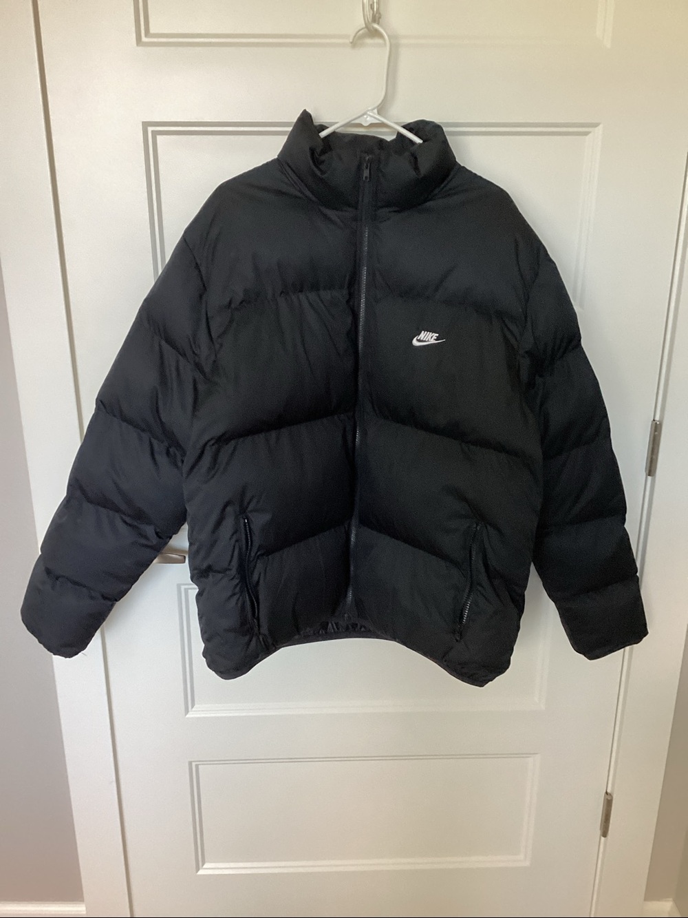 Nike Black Quilted Puffer Jacket with White Swoosh, Primaloft fill.